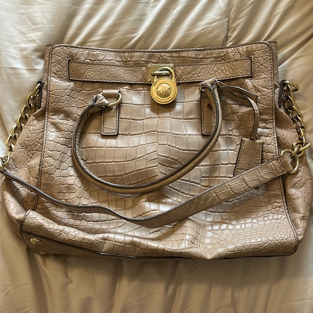 Woman’s Tan Michael Kors Bag